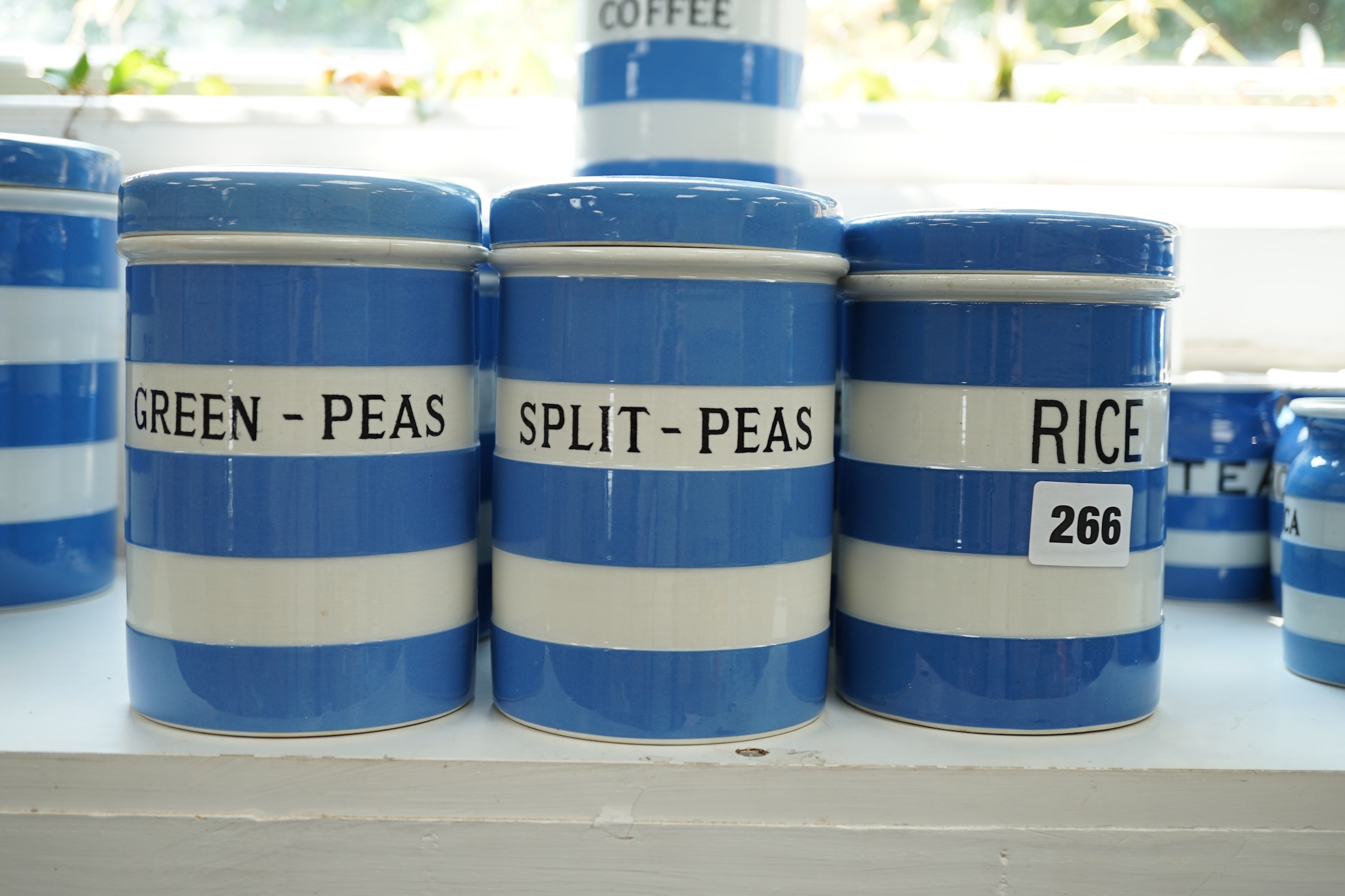 T.G.Green Cornish Kitchenware, ten 14cm lidded storage jars to include Green-Peas, Split- Peas, Cornflour, Ground Rice and Barley, mainly Black Shield marks. Condition - poor, fair and good